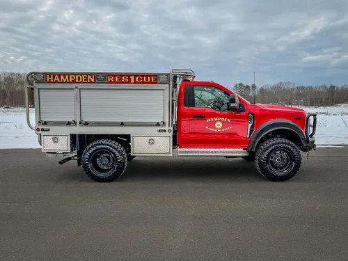 Passenger-side profile with closed compartments and off-road tires.